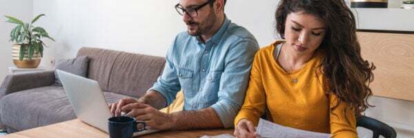 man-and-woman-looking-over-credit-card-bills-hero-feature-600x200
